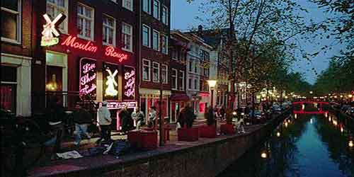 Amsterdam to halve shop window brothels and marijuana cafes