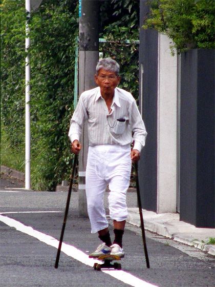 Old man skateboarding 12700