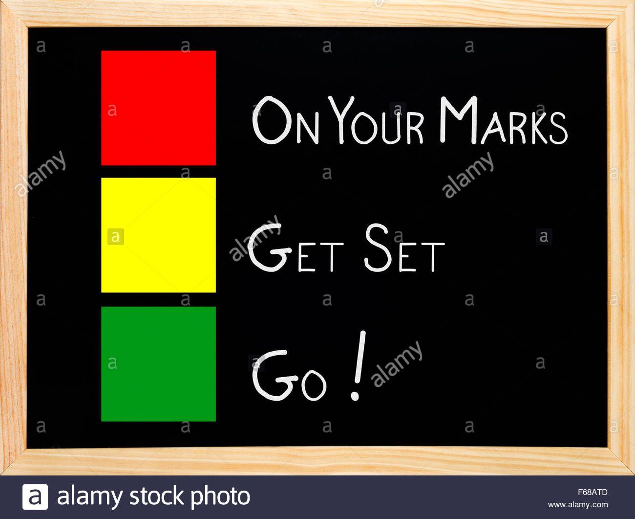 On your mark get set go written on blackboard or chalkboard with traffic F68ATD