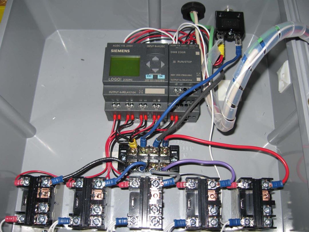 Pump controller inside view relays plc