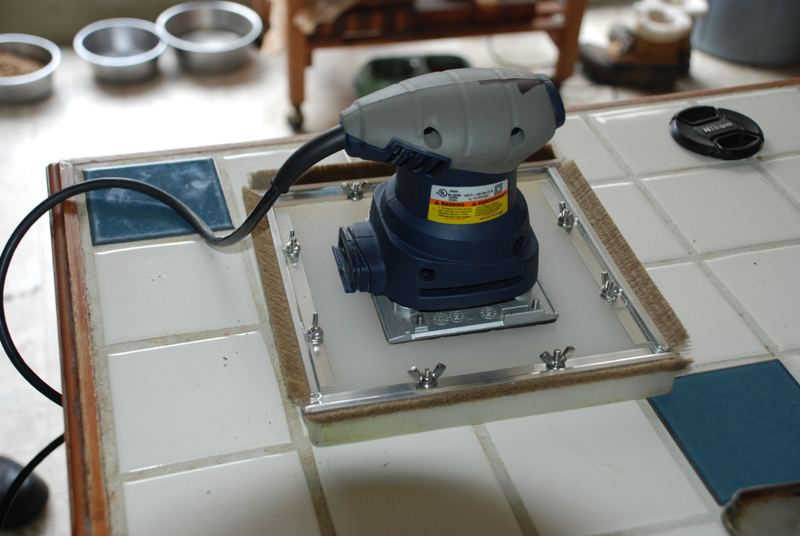 Top plate and palm sander