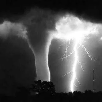 Night photograph of a tornado illuminated by lightning photo by Fred Smith used with Q640